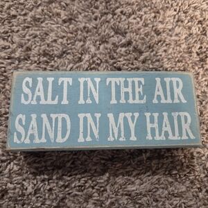 Blue Wooden Sign with White Beachy Text